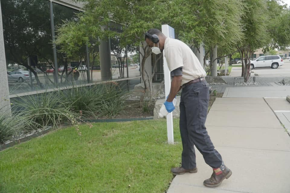 Employee prepping ground for extermination of pest